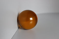 Glazen oranje bol met diameter 70 mm.