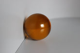 Glazen oranje bol met diameter 60 mm.